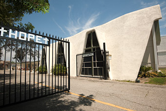 Detail of painted gate and facade of church in Carson, CA